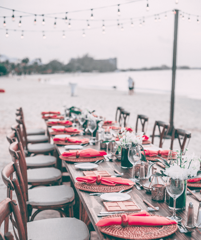 wooden banquet table on a beach