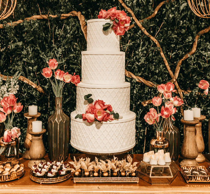 cake table decorated with candles and tulips